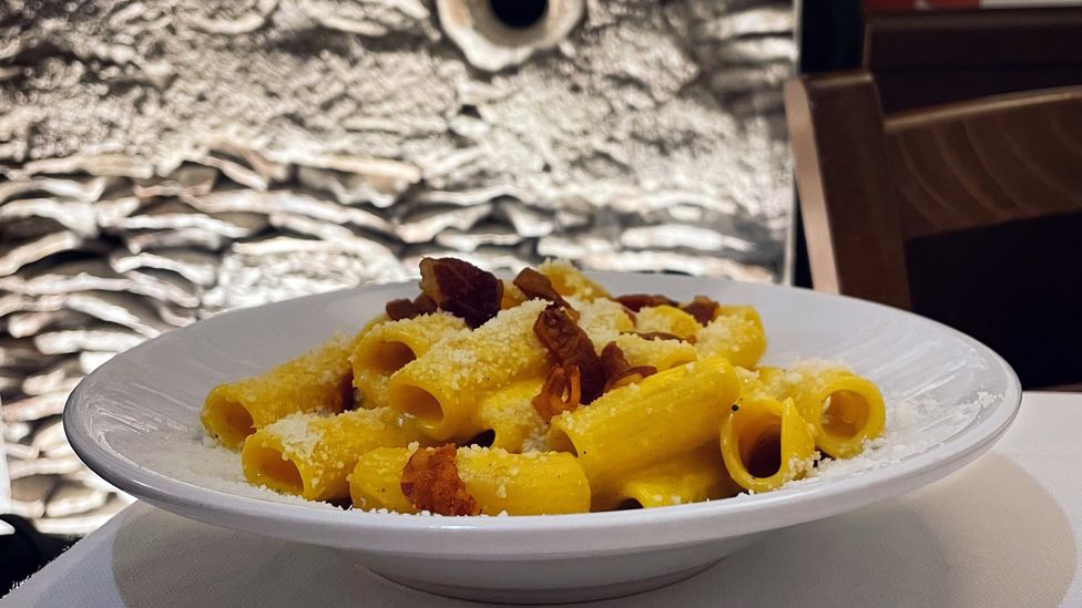 At Flavio al Veloavevodetto, you can enjoy a plate of carbonara while looking onto the remains of a Roman mound (Credit: Andrea Carlo Martinez)