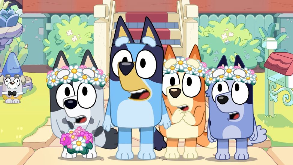 A still of Bluey, Bingo, Muffin and Socks as wedding flower-girls in kids' TV series Bluey