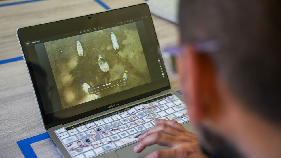 Man looking at computer screen displaying river (Credit: Kimberley Brown)