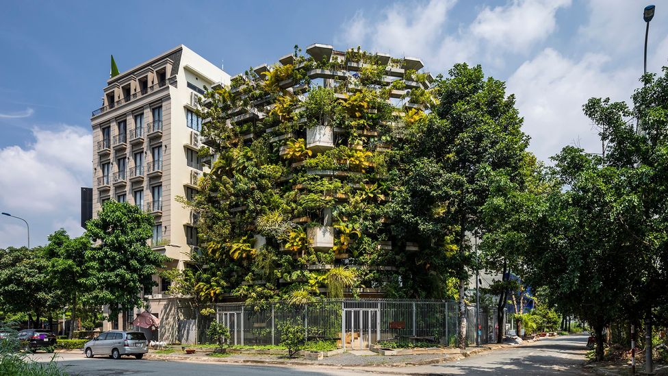 Overhanging planters on Ho Chi Minh City's Urban Farming Office allow vertical food production and create a microclimate that means aircon is not needed (Credit: VTN Architects)