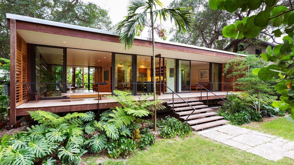 Despite being in Miami, Florida, this house has the feel of a tropical refuge, with outdoor living areas on front and back porches (Credit: Claudia Uribe)