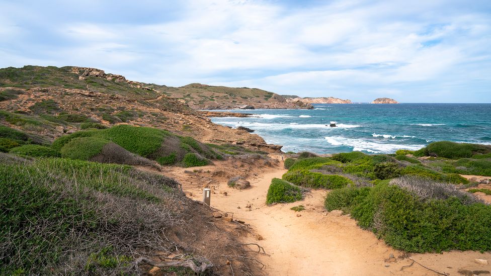 The 185km Camí de Cavalls coastal path is an excellent way to explore the island (Credit: Getty Images)