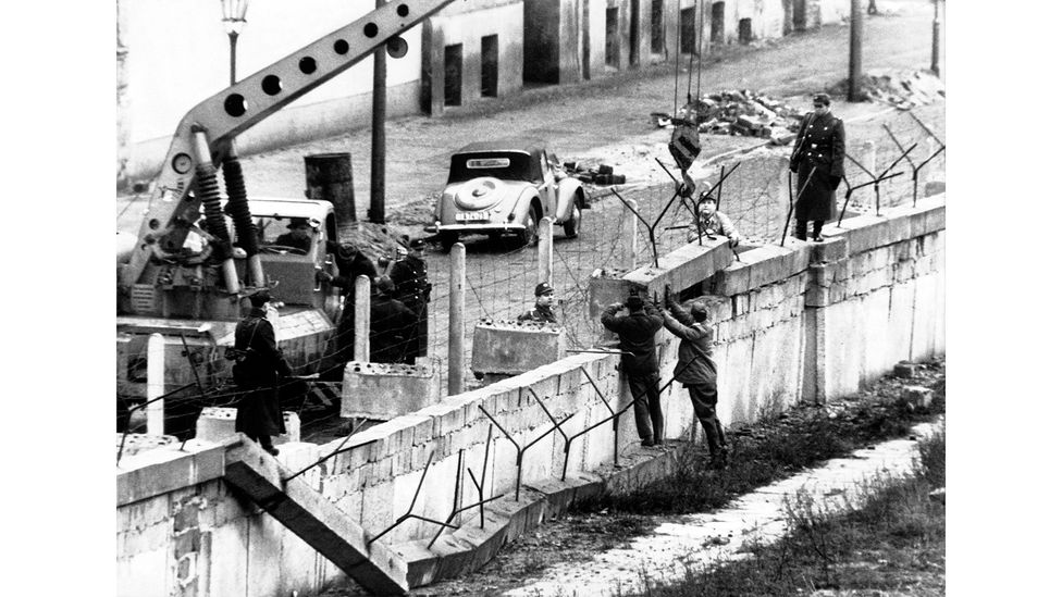 East Germany builds the Berlin Wall in 1961 to stop East Germans from leaving for the West (Credit: Getty Images) East Germany builds the Berlin Wall in 1961 to stop East Germans from leaving for the West (Credit: Getty Images)