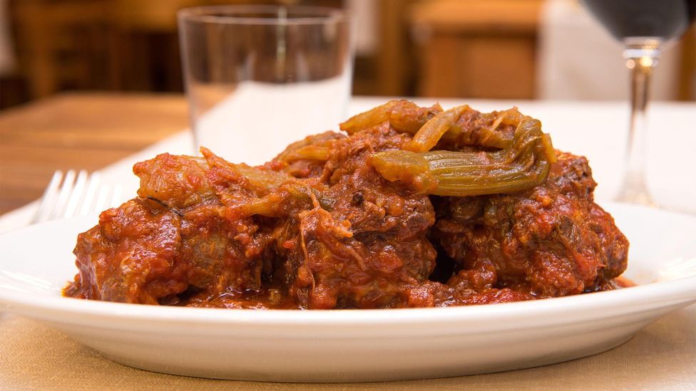 Coda alla vaccinara originated in Testaccio and is now one of Rome's most iconic dishes (Credit: Alamy) Coda alla vaccinara originated in Testaccio and is now one of Rome's most iconic dishes (Credit: Alamy)