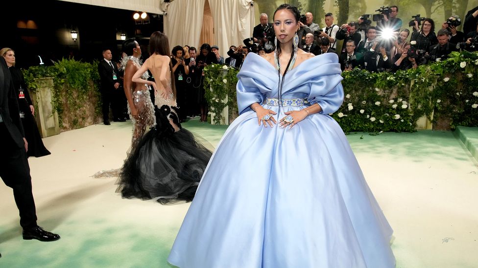 At this year's Met Gala, Chasing Horse wore a dress with a princess silhouette in the color of forget-me-not, Alaska's state flower. (Credit: Getty Images)