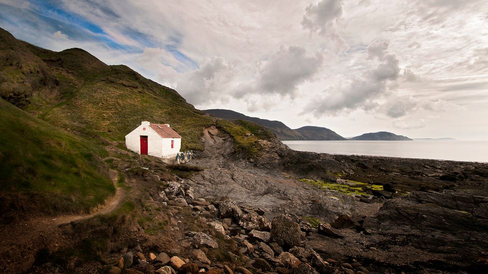 One of the best ways to get to the heart of this cliff-fringed island is to explore it on foot (Credit: Getty Images)