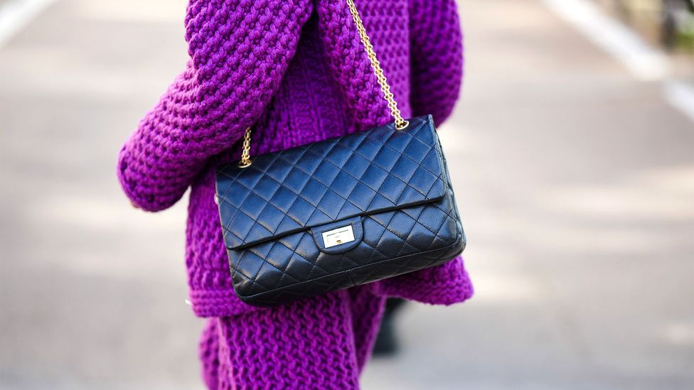 The Chanel 2.55 was the first IT bag, created by Coco Chanel in 1955, and its shoulder chain was a revolutionary innovation (Credit: Getty Images)