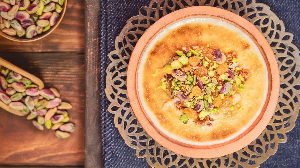 A birds eye view of a bowl of Om Ali (Credit: Alamy)