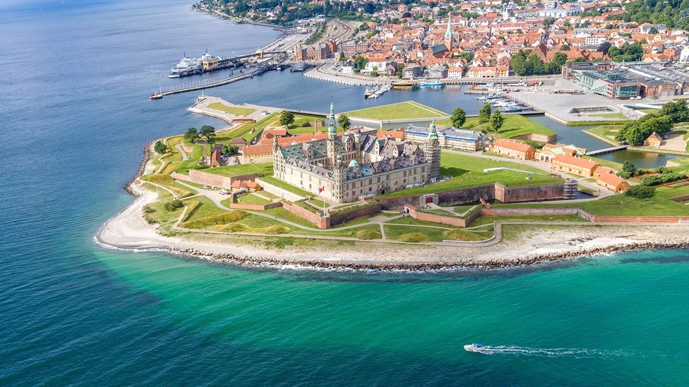 Aerial view of Kronborg Castle on promontory with Helsingør in background and the sea in the foreground (Credit: Thomas Rafn-Larsen)