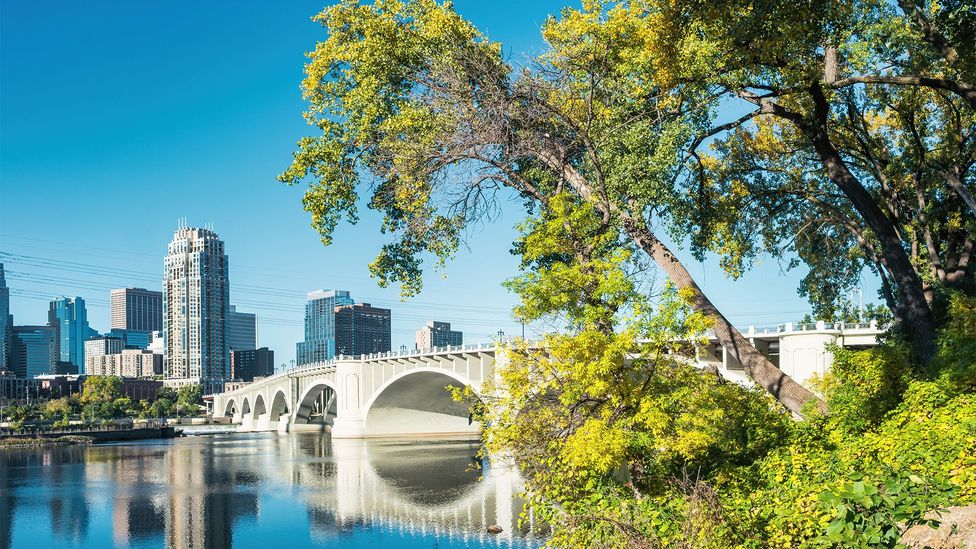 Skyline of downtown Minneapolis with the Third Avenue Bridge and the Mississippi River (Credit: Getty Images)
