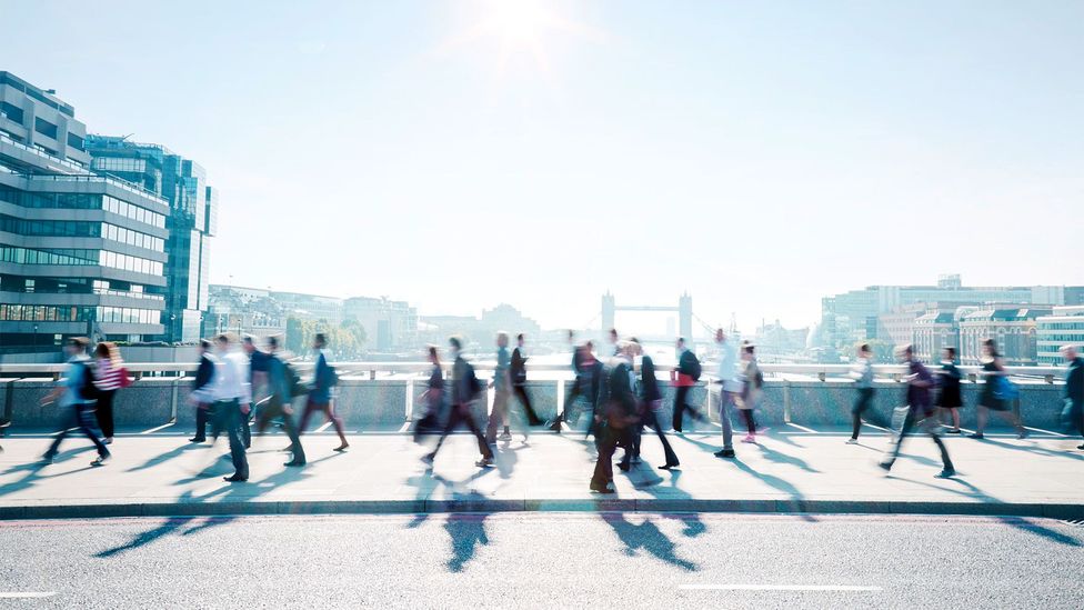 Workers walking over a bridge (Credit: Getty Images)