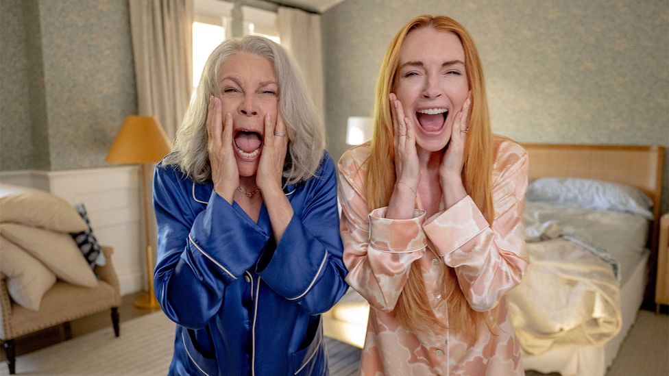 Jamie Lee-Curtis and Lindsay Lohan holding their cheeks screaming in Freakier Friday (Credit: Glen Wilson)
