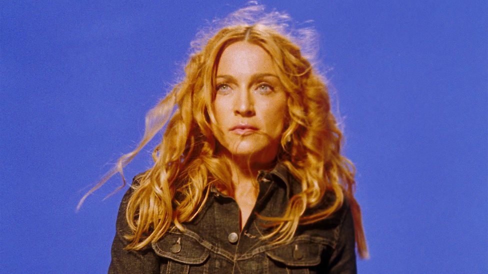 Madonna still from music video in 1998 against a purplish-blue background (Credit: Getty Images)