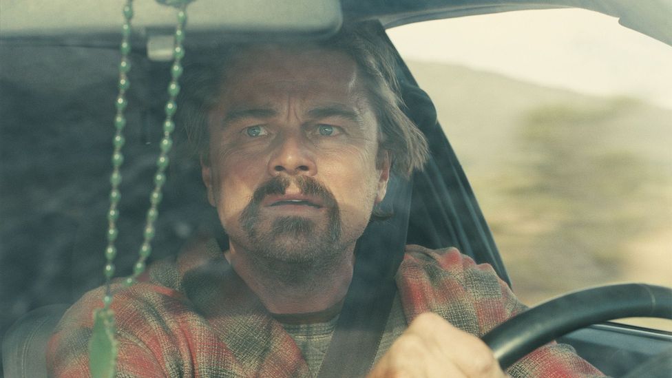 Leonardo Di Caprio driving a car in One Battle After Another (Credit: Warner Bros. Pictures)