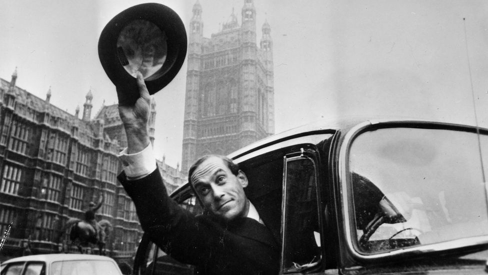 Black-and-white archive image of the leader of the Liberal Party Jeremy Thorpe celebrating his win, waving from a car with the Houses of Parliament in the background (Credit: Getty Images)