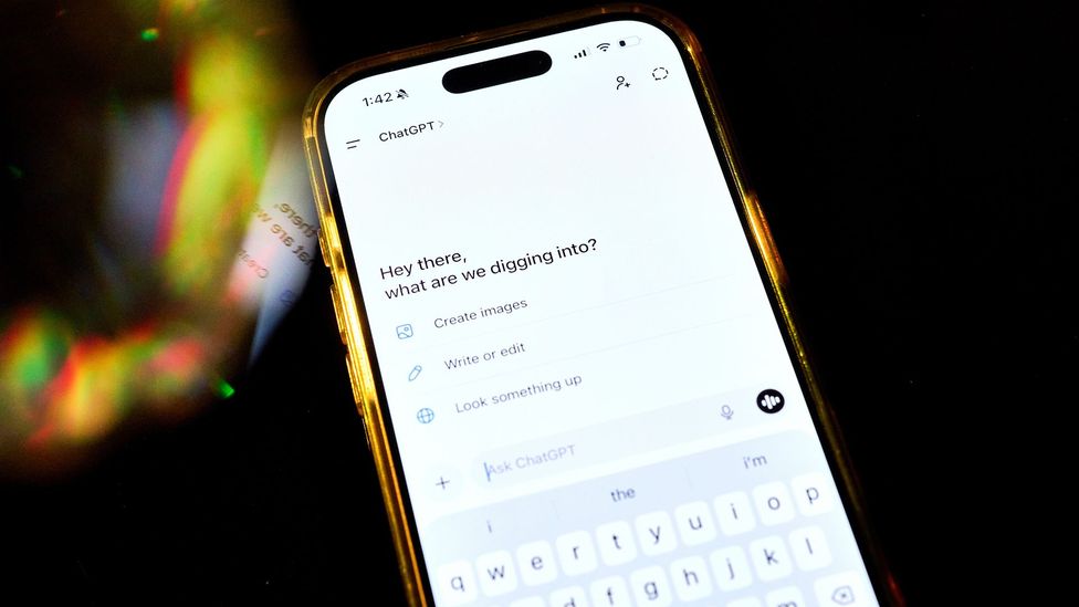 A phone with ChatGPT on the screen with the words "Hey there, what are we digging into?" displayed (Credit: Getty Images)