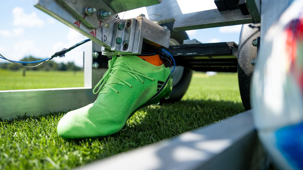 A machine that stamps a football boot onto the grass provided vital data about how players would perform on different turf (Credit: Nick Schrader/Michigan State University)