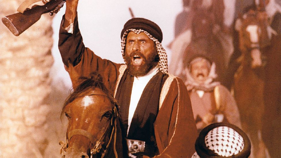 A still of a man riding a horse and holding up a gun in Clash of Loyalties (Credit: Iraqi Film Corporation)