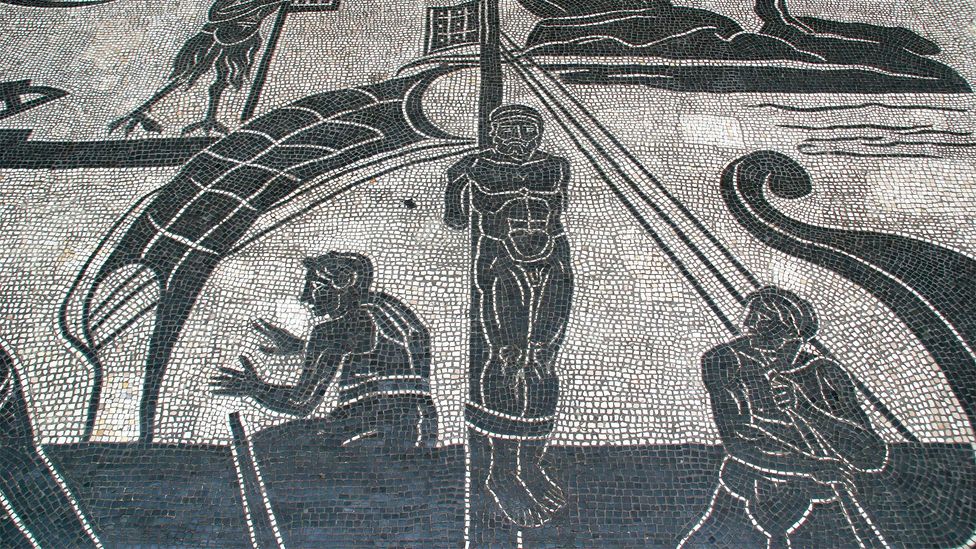 A black-and-white mosaic showing the Greek hero Odysseus tied to a ship mast (Credit: Getty Images)