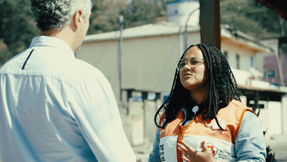 A woman is talking to a man A woman is talking to a man