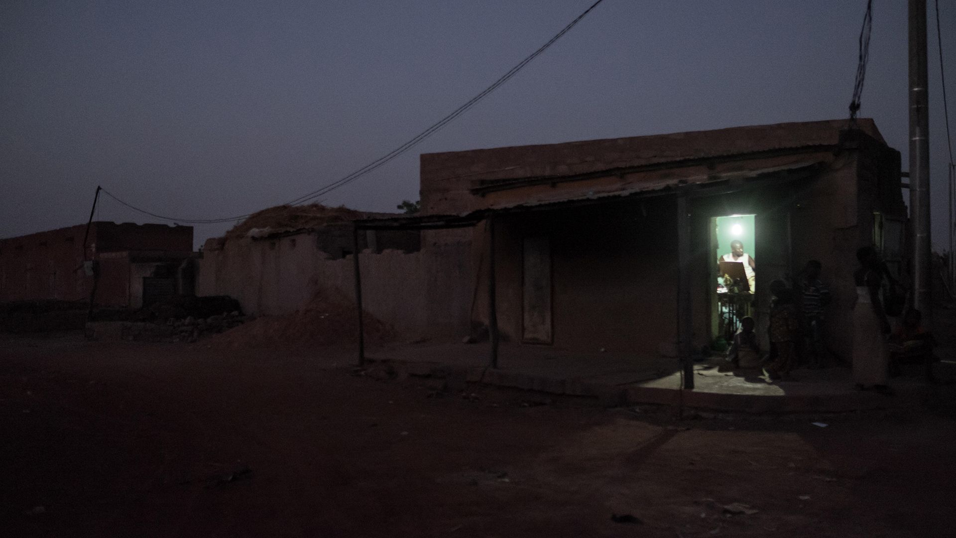 Connecting remote settlements in Africa to the electricity grid can transform the lives of people living there (Credit: Alamy)