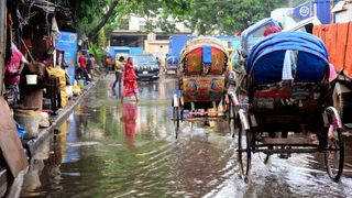 Flooding is a regular part of life in Dhaka, but the city is being adapted to survive the more extreme floods of the future (Credit: Getty Images)