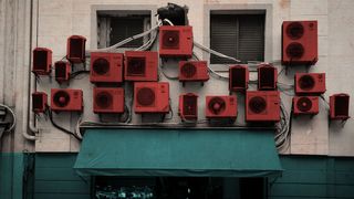 Air-conditioning units on a wall (Credit: Javier Hirschfeld/ Getty Images)