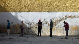 Voters in a socially distanced queue in Caracas (Credit: Getty Images)